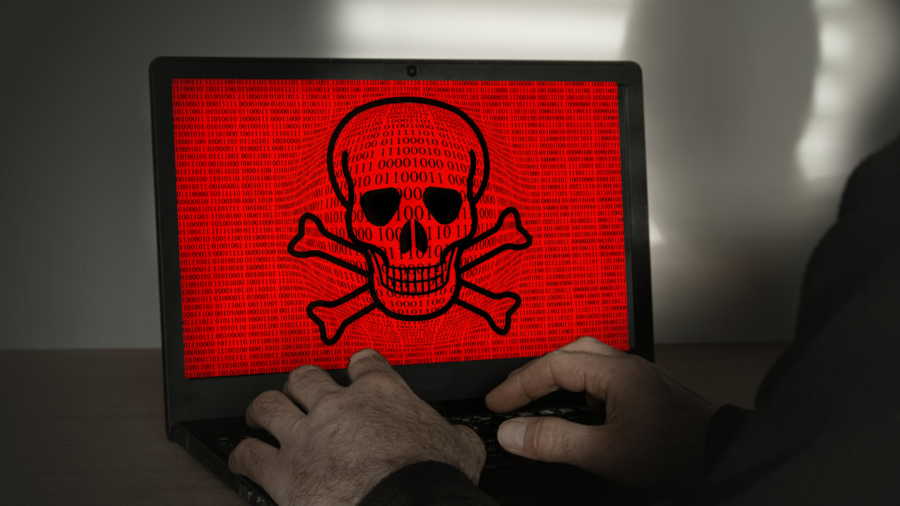 Laptop with red and black skull on screen