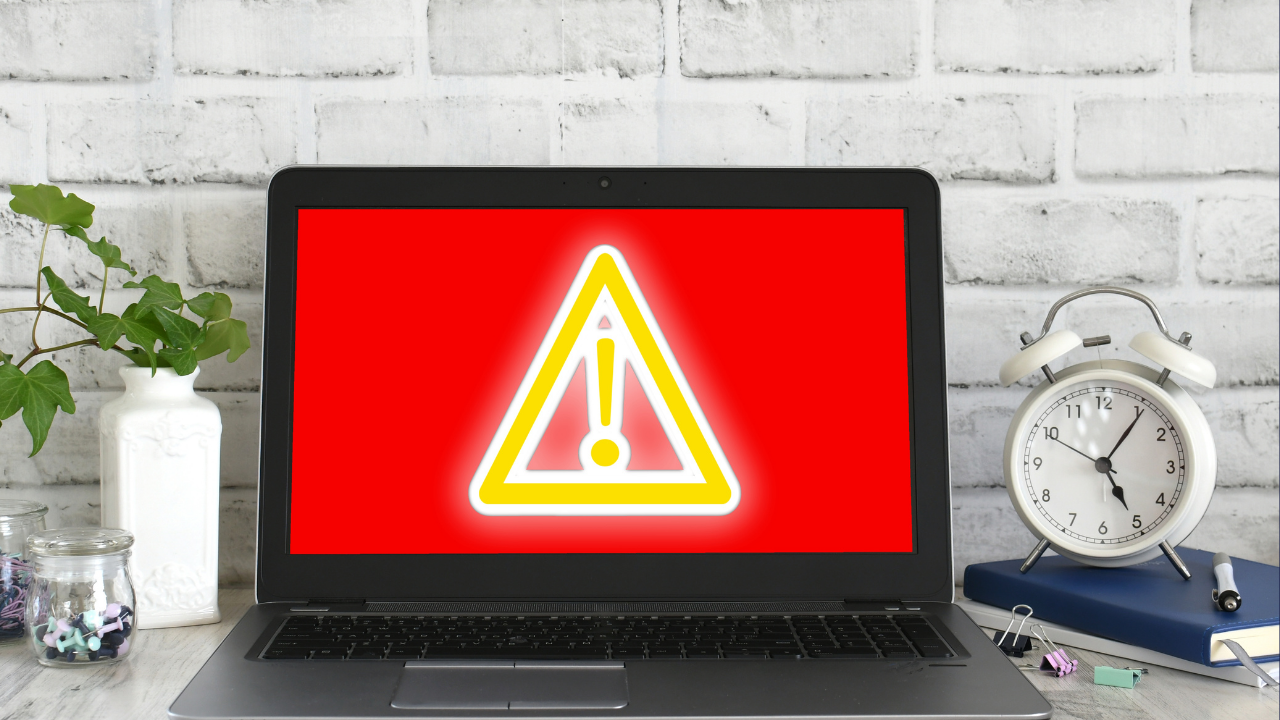 Laptop with a big red warning sign on the screen