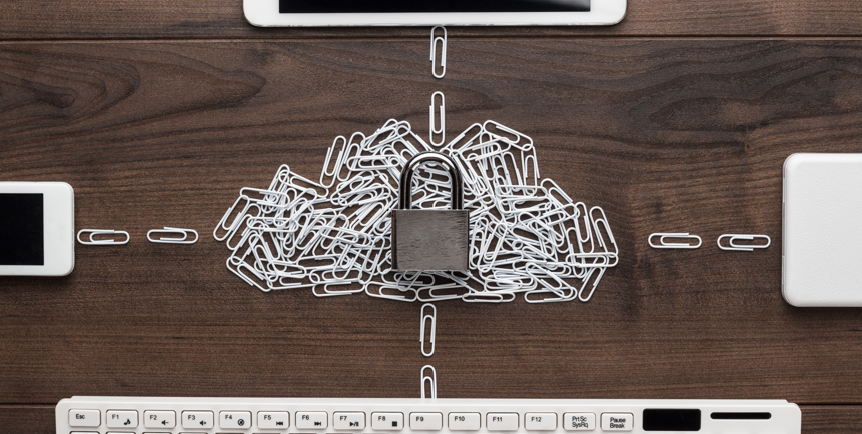 Image of padlock on top of a pile of paper clips shaped like a cloud and various devices surrounding the cloud.