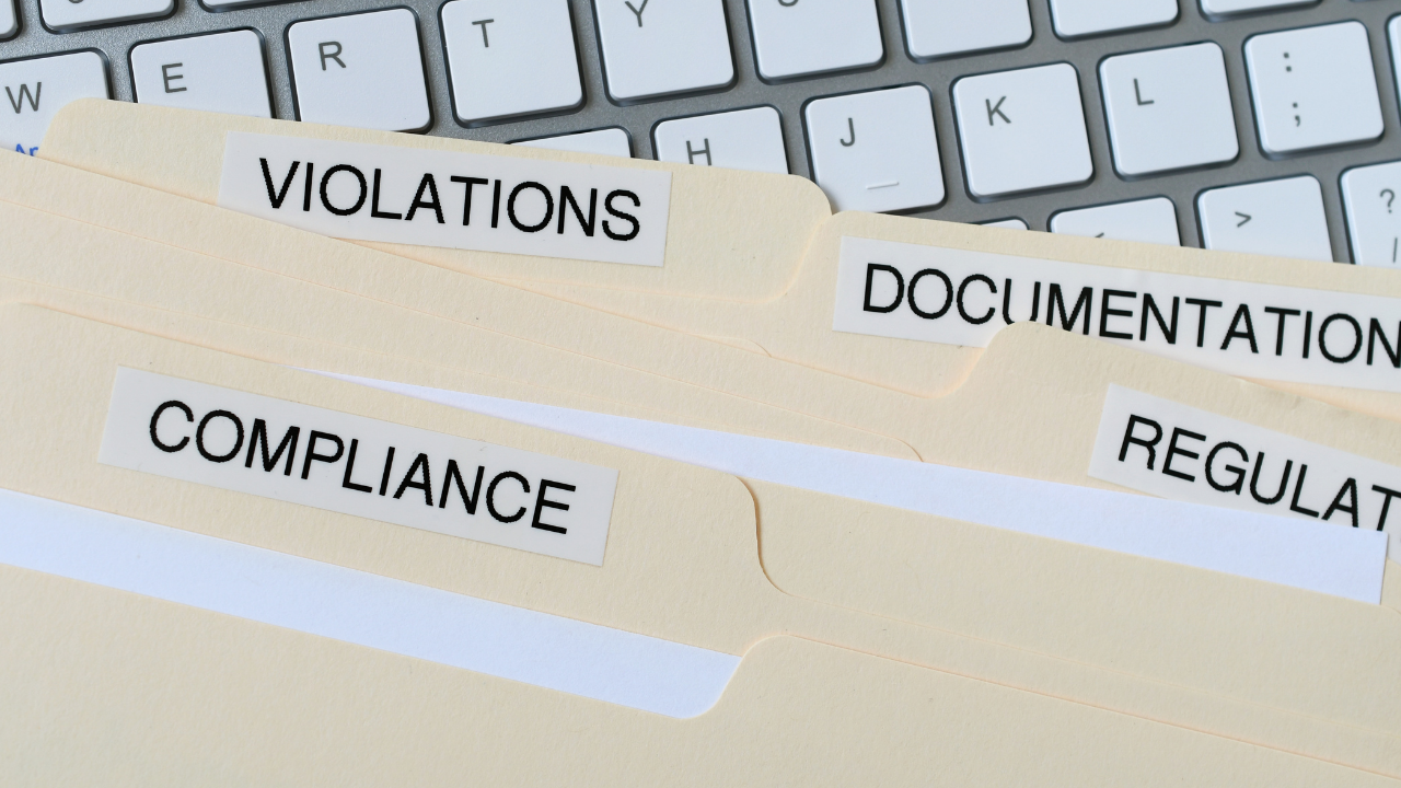 Files labeled violations, compliance, documentation, and regulations