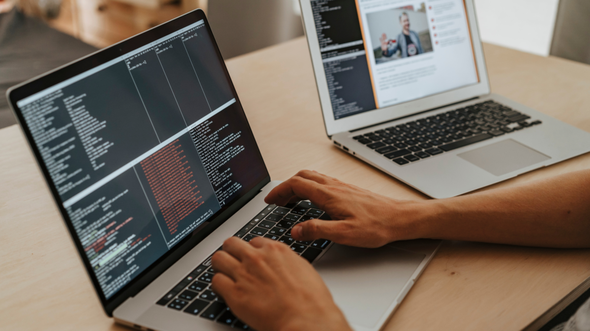 Man coding on laptop