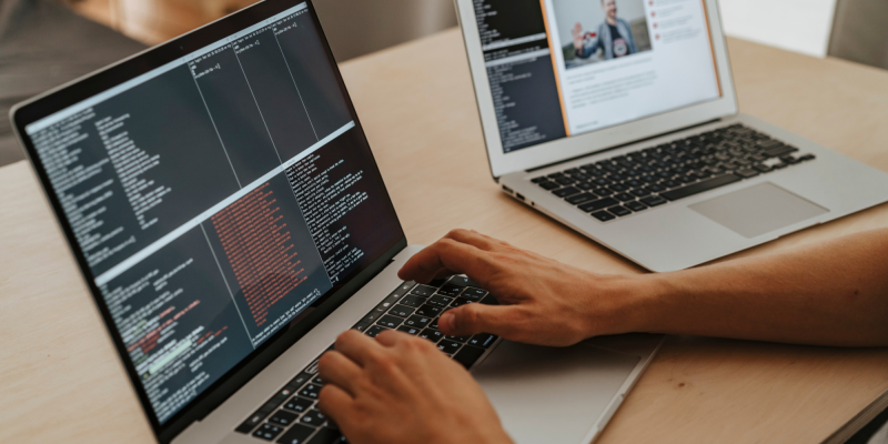 Man coding on laptop
