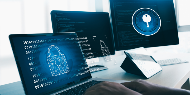 Collaboration security: Laptop and desktop with blue lock icon